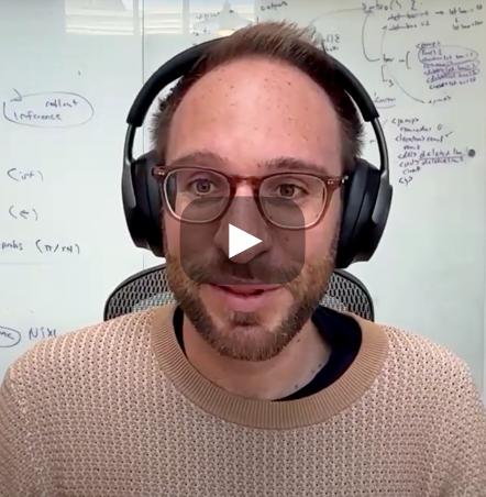 A photo of Sasha Rush wearing headphones